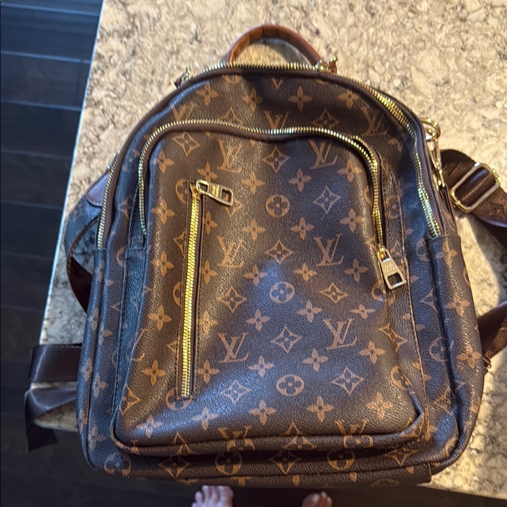 Louis Vuitton Brown Monogram Backpack with Gold Zippers